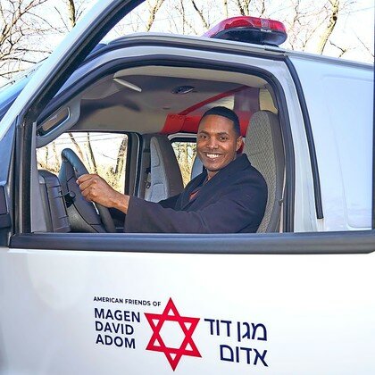 Rep. Ritchie Torres tries out the driver&rsquo;s seat of the new MDA ambulance being sent by the Riverdale community to Israel