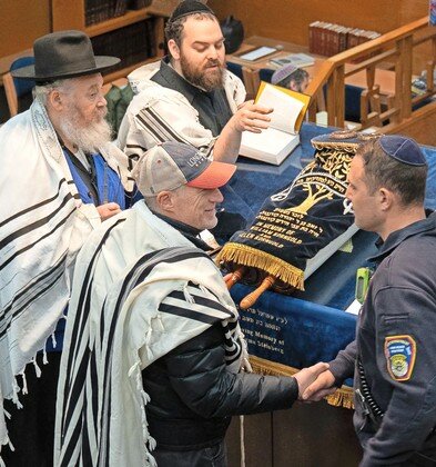 Purim at BACH in Long Beach, counter clockwise from top: Yizchok Klitnick, Yochi Klitnick, Mitch Foont and Long Beace Fire Department Firefighter Sam Pinto.