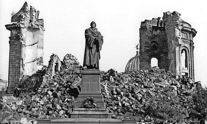 A statue of Protestant Reformation Martin Luther in the Ruins of Dresden, Germany, in the aftermath of World War II.