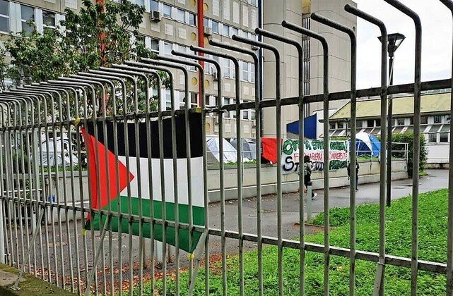 Pro-Palestinian flag and signs at the University of Milan, Italy.