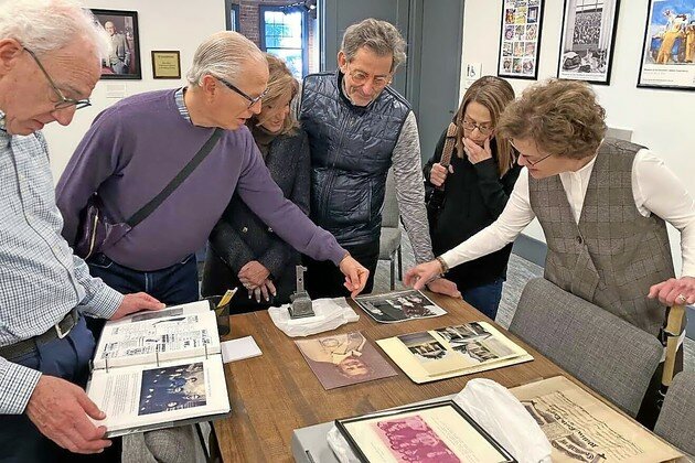 Visitors from Birmingham, Ala., explore family items donated to the museum.