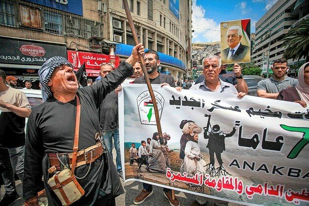 Palestinian protesters mark the anniversary of the &ldquo;nakba&rdquo; in the West Bank city of Nablus on May 15.