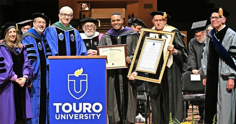 From left: Dr. Marian Stoltz Loike, Dean of Touro&rsquo;s Lander College for Women; Rabbi Moshe Krupka, Touro Executive VP; at podium, Touro President Dr. Alan Kadish; Dr. Stanley Boylan, VP for Undergraduate Education; Rep. Ritchie Torres; and Dr. Robert Goldschmidt, Dean of Touro&rsquo;s Lander College of Arts &amp; Sciences.