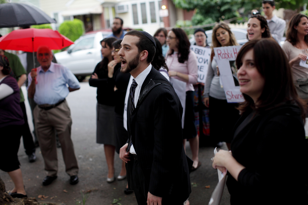 Rabbi Jeremy Stern, center, Executive Director of The Organization for the Resolution of Agunot, leads a rally to denounce Aharon Friedman who will not give his wife a get, despite the fact that they have already been granted a divorce in civil court, in Brooklyn, Wednesday, August 18, 2010.