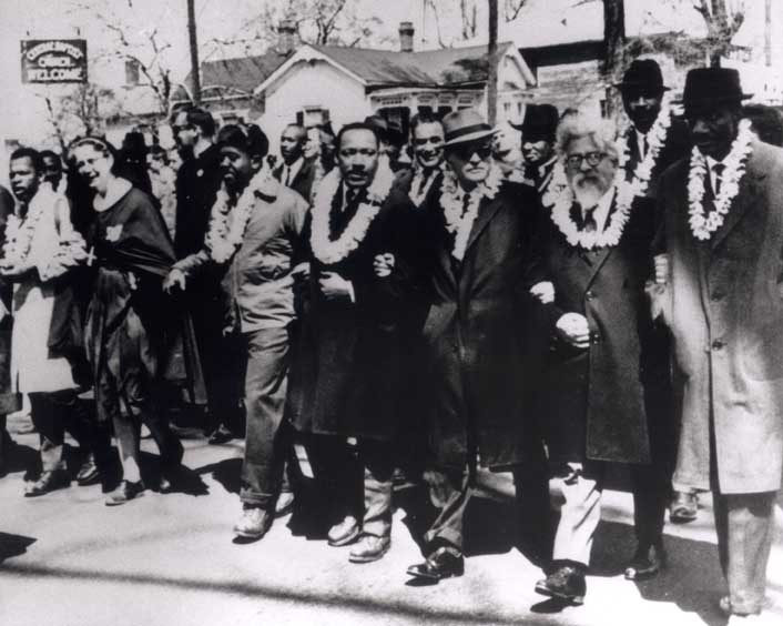 Rabbi Abraham Joshua Heschel marches along side Martin Luther King Jr.  in Selma, Alabama.