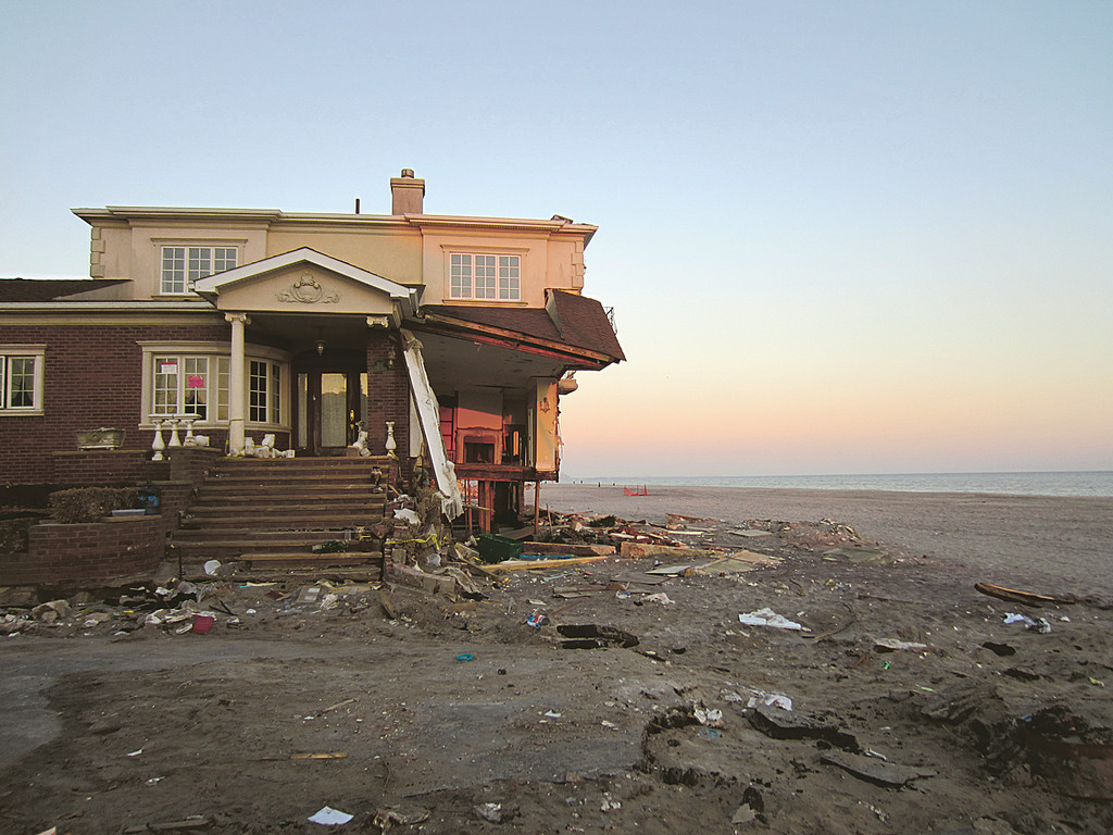 A beach-front house in Belle Harbor wrecked by 
Hurricane Sandy stands vacant and open to the elements.