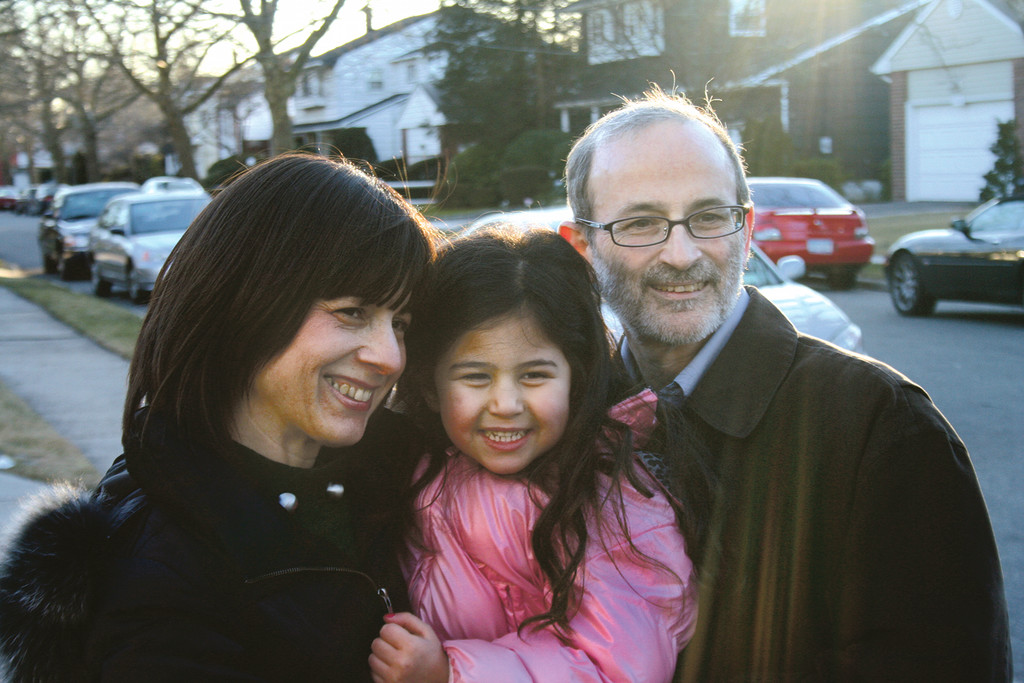 One happy family: from left, Sara, daughter Meira, and Azriel Ganz, foster and then adoptive parents through OHEL.