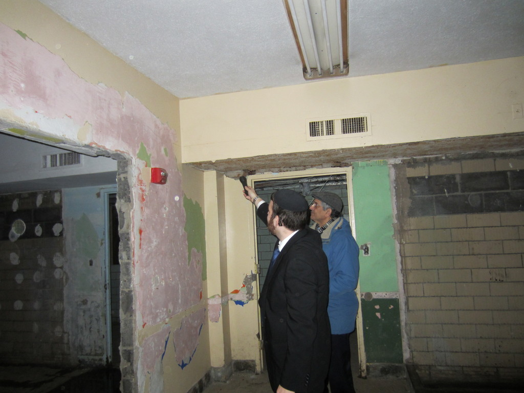 Rabbi Tsvi Selengut in the stripped down basement of Ohab Zedek after the destruction of Sandy.