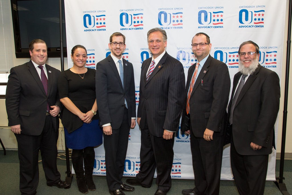 Jake Adler and Zehava Birman, OU associate director for New York field operations; Jeff Leb, OU New York director of political affairs; Ed Mangano; Maury Litwack, OU director of state political affairs and outreach, and Rabbi Mordechai Kamenetzky, Rosh HaYeshiva of Yeshiva of South Shore in Woodmere.