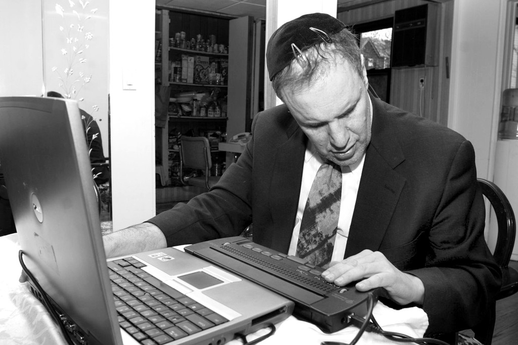 Rabbi Michael Levy at work on his blog.