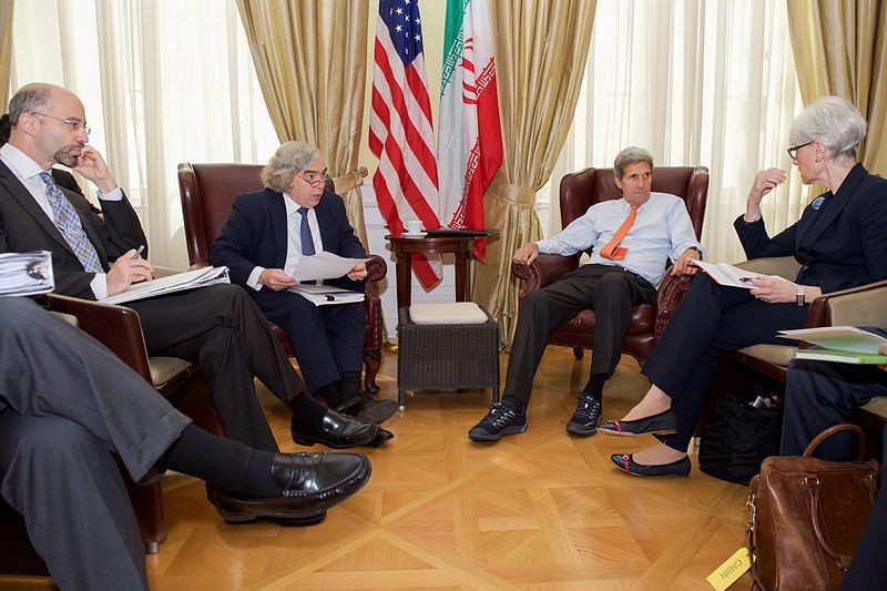 National Security Council Senior Director for Iran, Iraq, Syria and the Gulf States Robert Malley (at far left) joins a briefing of Secretary of State John Kerry on negotiations with Iran, with Under Secretary of State for Political Affairs Wendy Sherman, on June 28, 2015, in Vienna, Austria.