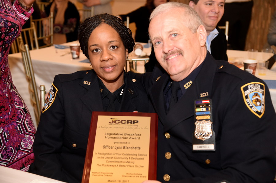Lynn Blanchette, Community Affairs Officer of Far Rockaway’s 101st Precinct, who received the JCCRP’s Humanitarian Award, is pictured with Police Officer Kevin Campbell.