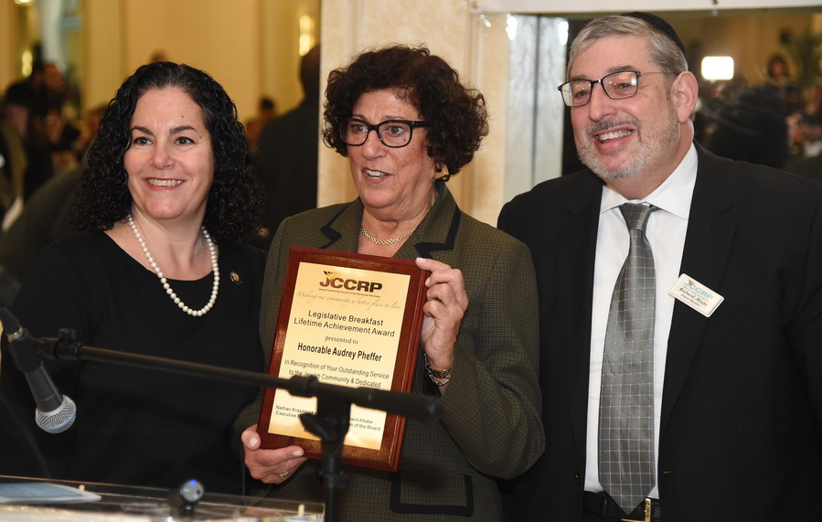 Assemblymember Stacey Pheffer Amato presents the JCCRP’s Lifetime Achievement Award to her mother, former Assemblymember and current Queens County Clerk Audrey Pheffer, as JCCRP Board Chair Richard Altabe looks on.