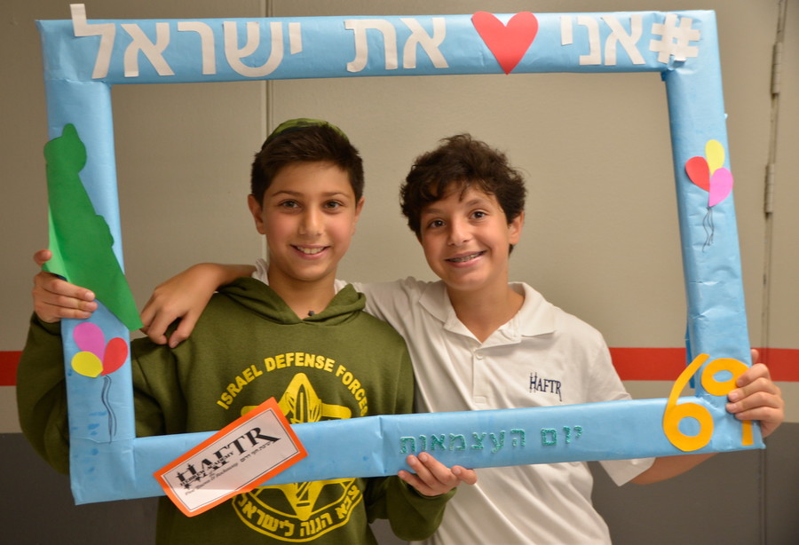 HAFTR Yom HaAtzmut: After pausing on Yom HaZikaron to remember the soldiers who gave their lives to make the State of Israel a reality, as night fell, Arie Assaraf and Eitan Hazan joined the Lower School celebration of Israel independence.