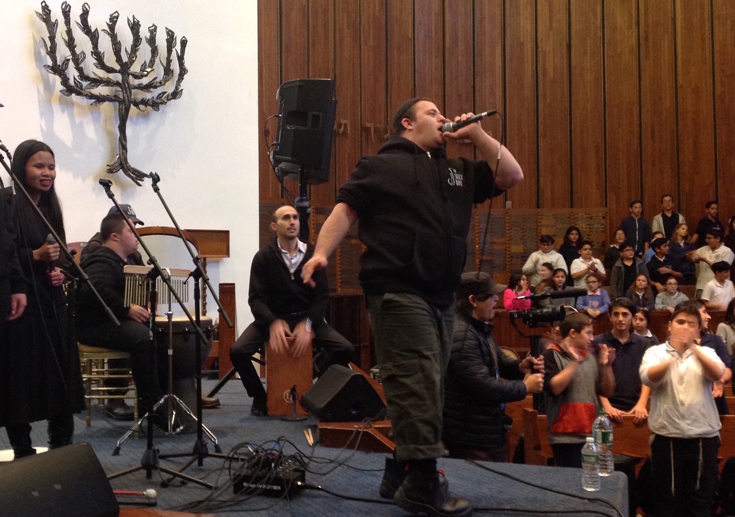 Yair Pomburg raps during a performance of the Shalva Band at the North Shore Hebrew Academy in Great Neck.