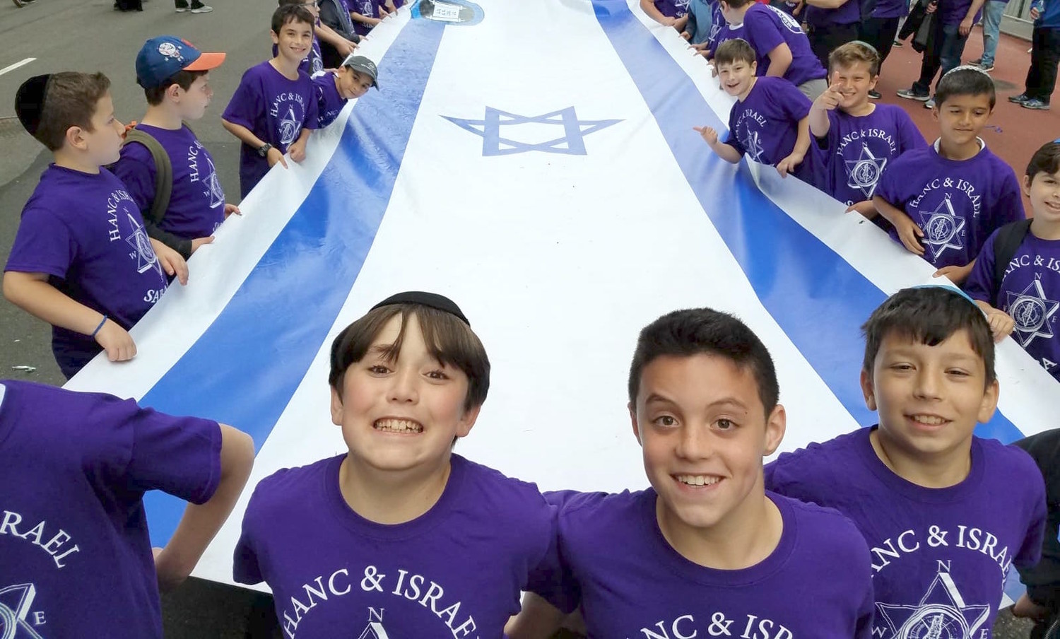 HANC's elementary school rolls out Israel's flag.