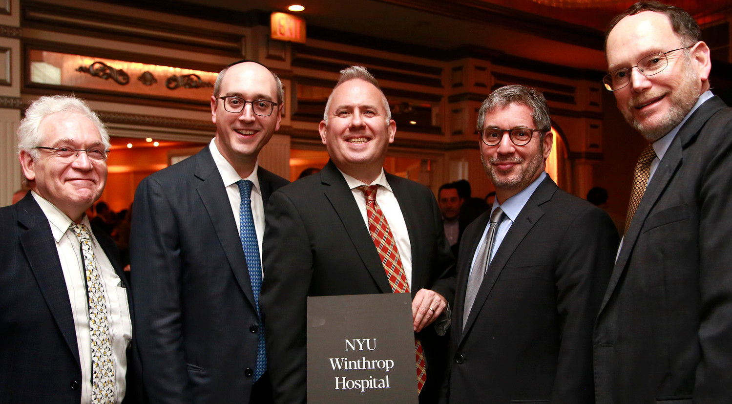 Among the staff of many hospitals and other medical institutions at the Achiezer gala were these representatives of NYU Winthrop Hospital — Dr. Martin Weinblatt, Dr. Tovia Marciano, Dr. Abraham Peller, Dr. Marc Adler and Bruce Cohn.