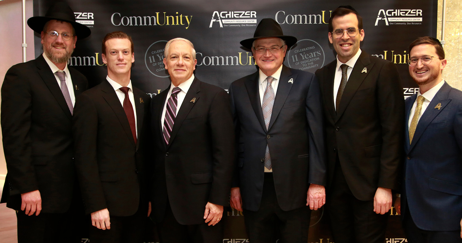 Awardee lineup, from left: Rabbi Yossy Ungar, pillars of chesed; Dr. Ari Hoschander and Dr. Martin Keller, excellence in medicine; Ronald Lowenger, who participated in the dedication of the Edith Lowinger A”H Achiezer Volunteer Network; Rabbi Boruch Ber Bender with Shalom Jaroslawicz who, with his wife Leah, received the young leadership award.