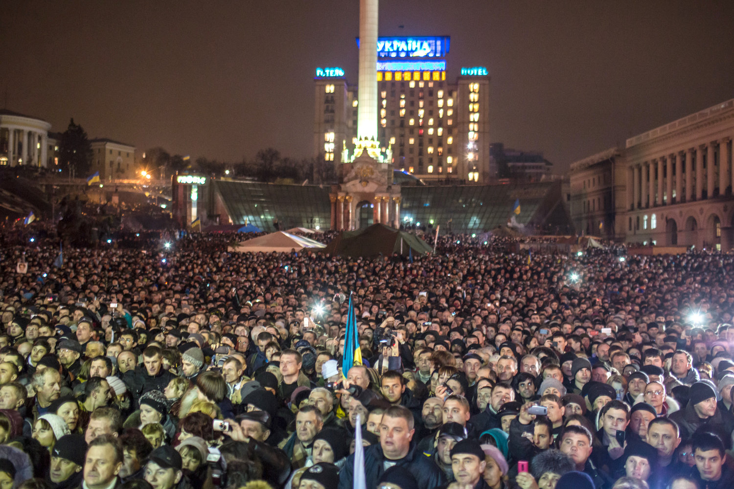 People listen as former Prime Minister Yulia Tymoshenko addresses anti-government protesters on Independence Square on Feb. 22, 2014 in Kiev, Ukraine.
