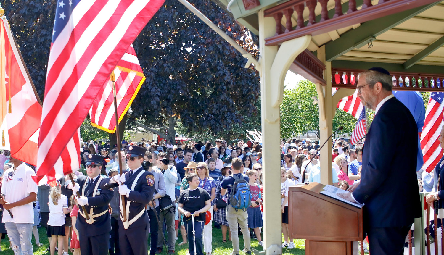 Rabbi Kenneth Hain of Congregation Beth Sholom in Lawrence said a prayer at the gathering in Cedarhurst’s Andrew J. Parise Park.
