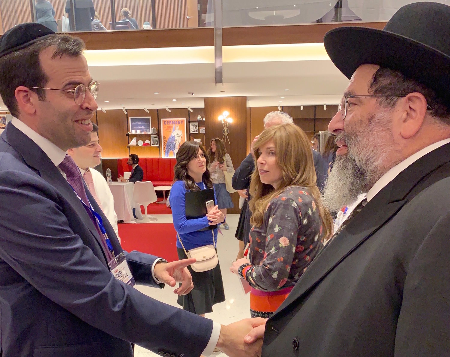 Achiever President Boruch Ber Bender greets his father, Harav Yaakov Bender, rosh hayeshivah of Yeshiva Darchei Torah in Far Rockaway, at Achiezer's Jewish Healthcare Conference & Expo in the TWA Hotel at JFK, on Sunday, Sept. 15.