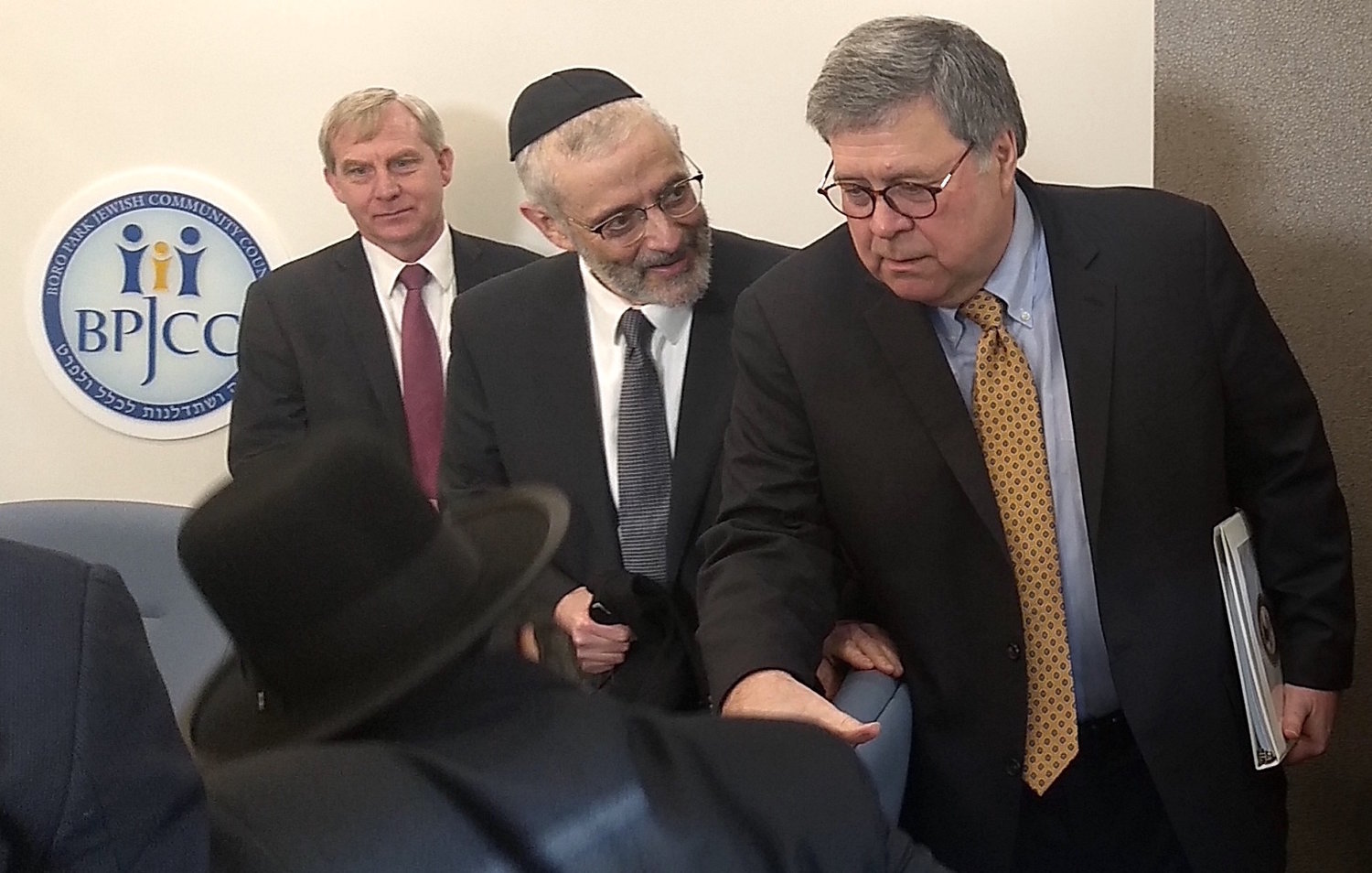 U.S. Attorney General William Barr (right) met in Borough Park with Orthodox leaders, including Agudath Israel of America Executive Vice-President Chaim Dovid Zwiebel (center) on Tuesday.