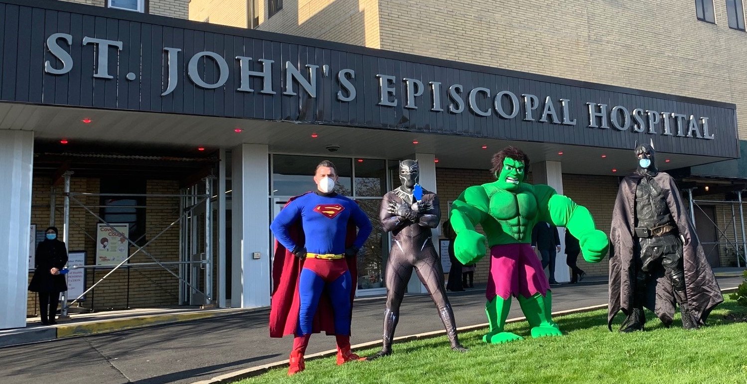Superheros greet the coronavirus heros outside St. John's Episcopal Hospital in Far Rockaway.