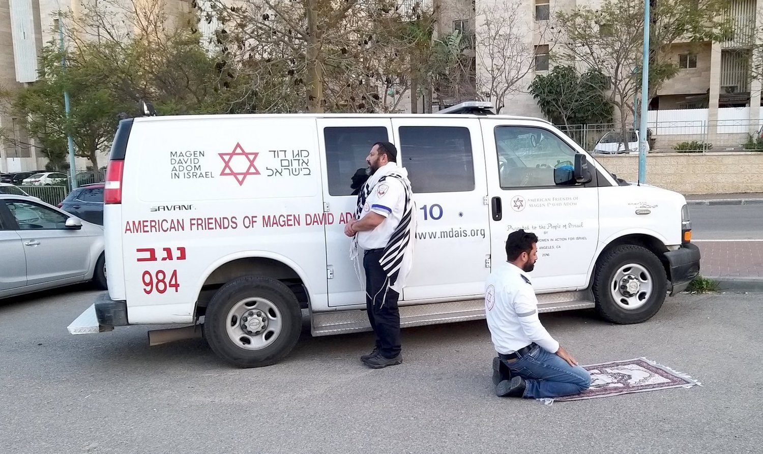 An Magen David Adom team -- a Jew and a Muslim -- each pray in their own way.