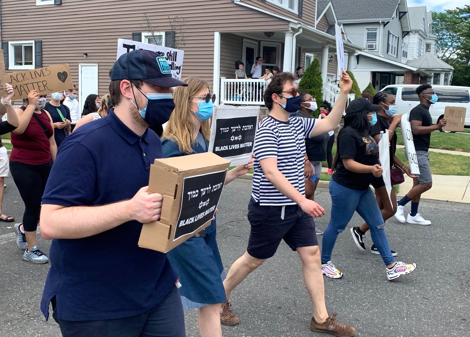 Some of the hundreds of protesters who marched through Cedarhurst and Lawrence on Sunday, on Cedarhurst Avenue at Monroe Street enroute to Andrew Parise (Cedarhurst) Park.