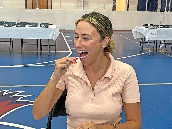 Tzipporah Zimmer of West Hempstead swabbed the inside of her mouth at the Gift of Life Marrow Registry drive at HAFTR High School in Cedarhurst on Sunday.