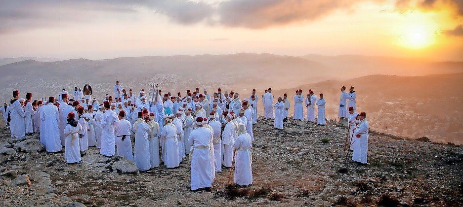 Samaritans, who are guided only the Five Books of Moses and not rabbinic traditions, pray during a Sukkot pilgrimage on Mount Gerizim on the outskirts of Nablus on Oct. 20. As visitors return to a post-pandemic Israel, visiting the Samaritans will be on some itineraries. See Travel on page 10.