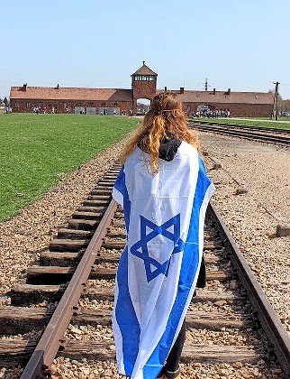 On the rails leading into a concentration camp, during a visit by HAFTR students in 2016.
