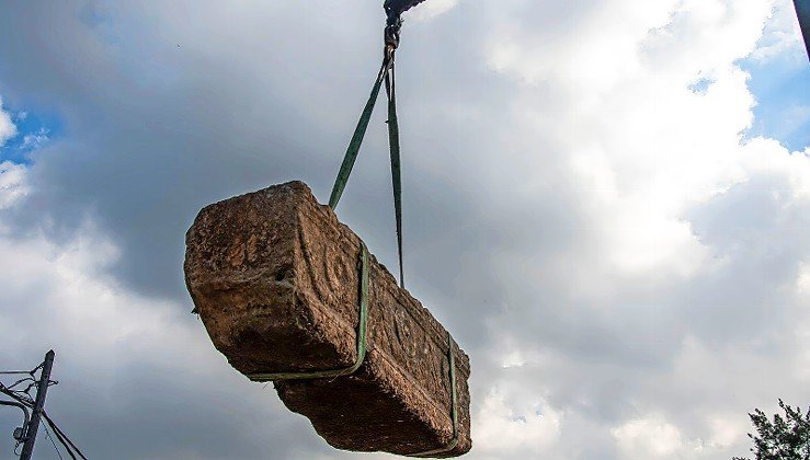 An ancient sarcophagi, unearthed at the Ramat Gan Safari Park, hangs high off the ground.
