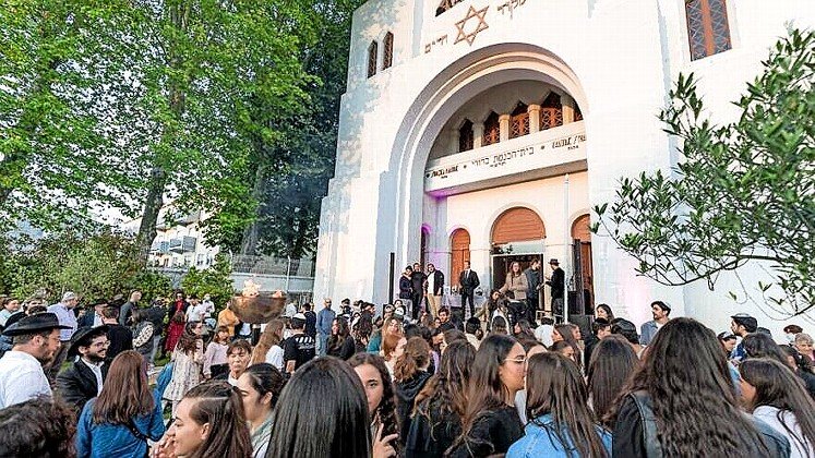 Members of the Jewish congregation stand outside the Kadoorie Mekor Haim Synagogue in Oporto, Portual.