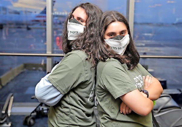 Twin sisters Ziv and Noam Wahba from the state of Georgia, at Miami International Airport before their aliyah flight to Israel on Aug. 10, 2021.