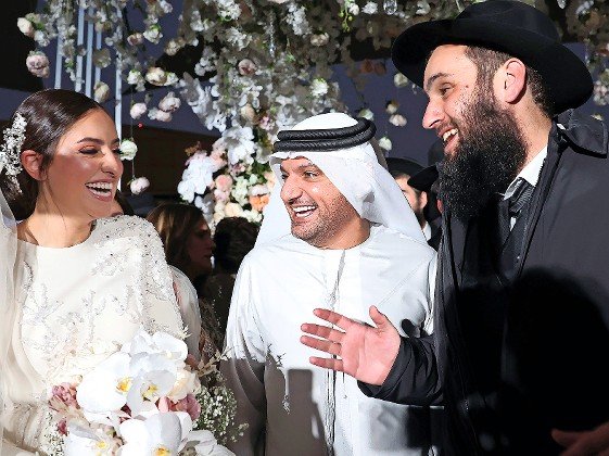 An Emirati government official greets Lea Hadad and UAE Rabbi Levi Duchman at their wedding in Abu Dhabi. 1,500 guests from around the world, including leading rabbis, dignitaries and Emirati royals, attended.