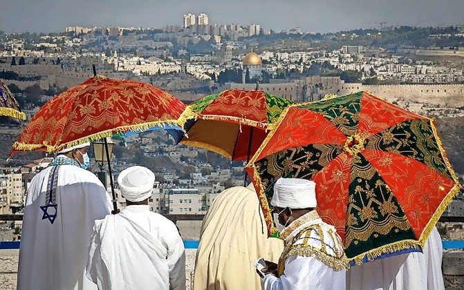 People take in an exception view of Jerusalem from the Haas-Sherover-Goldman Promenade, pictured during the Ethiopian Jewish community’s annual Sigd celebration.