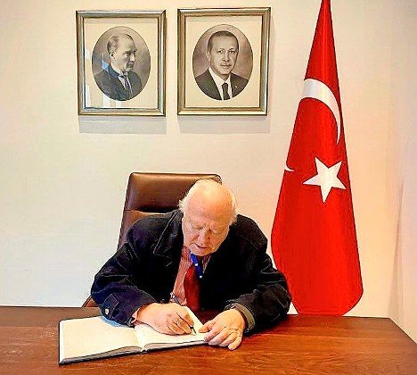 Miguel Moratinos, UN high representative for the Alliance of Civilizations, signs the condolences book at the Turkish Mission to the UN, on Feb. 11. UN Turkish Mission.