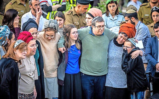 Parents and siblings of Hallel and Yagel Yaniv at the brothers’ levaya in the Mount Herzl military cemetery in Jerusalem on Monday.