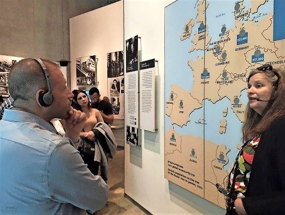 Sharaka participants listen to a guided tour at Yad Vashem in Jerusalem.