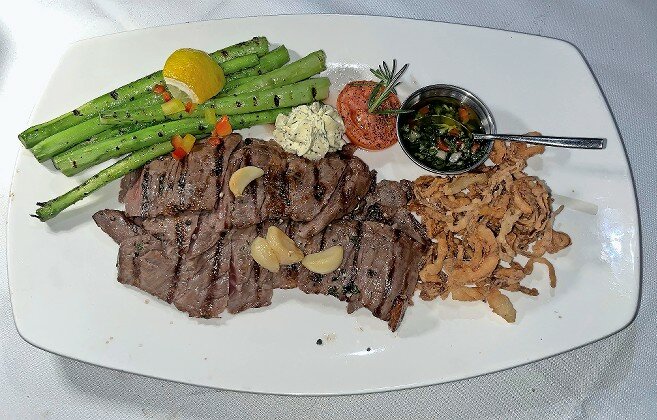 While there is a selection of great steaks on the menu at Yakar Steakhouse, our columnist suggests the Skirt Steak with Grilled Asparagus.
