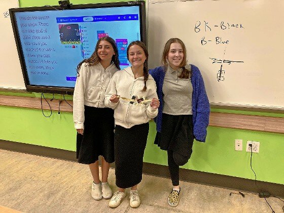 HALB eight grade girls showing what they did for their STEM project