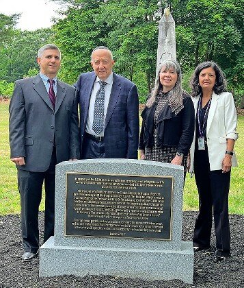 Standing behind a new marker unveiled at Friday’s ceremony, from left: Touro Law Professor Samuel Levine, director of the Jewish Law Institute; Rabbi Melvyn Lerer, who was chaplain at the Central Islip State Hospital; Elena Langan, dean of Touro Law School; and Martha Carlin, director of the Long Island Field Office of the NYS Office of Mental Health.