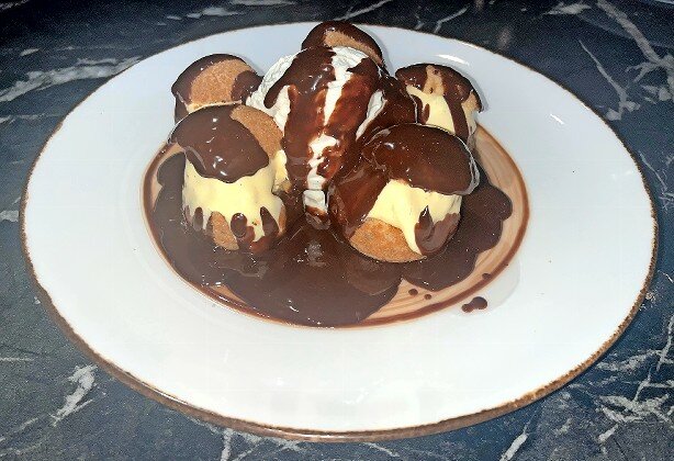 If there’s room for dessert, Profiteroles will fill it nicely.