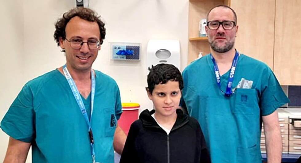 Dr. Ohad Einav and Dr. Ziv Asa with 12-year-old Suleiman Hassan.