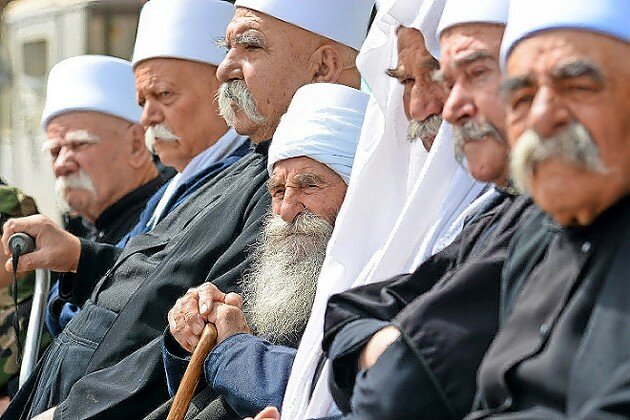 Israeli Druze from Majdal Shams gather during a rally to mark Syria’s Independence Day, in Majdal Shams, northern Golan Heights, on April 17, 2022.