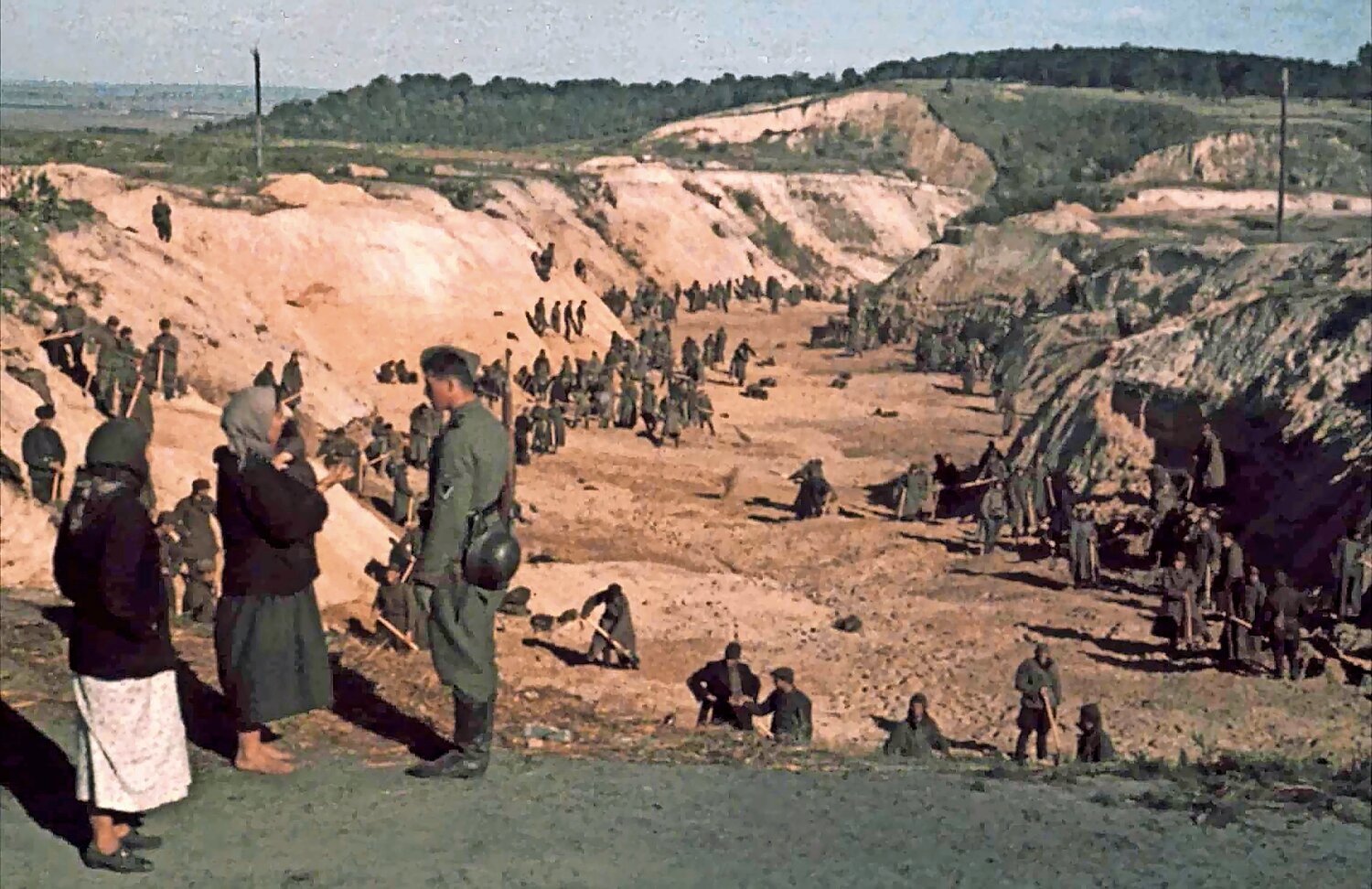 Soviet POWs cover a mass grave after Babi Yar massacre days earlier, Oct. 1, 1941.