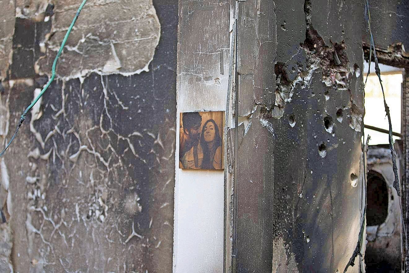A single photograph of a couple remains on the wall of a bullet-riddled home in Kfar Aza after Hamas terrorists rampaged through the community on Oct. 7, murdering families and taking civilians hostage.