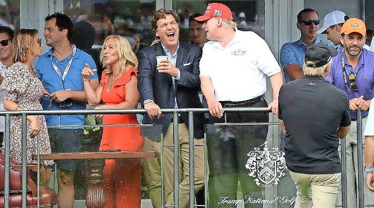 Tucker Carlson with former President Trump at the 16th hole during the final LIV Golf Tournament, at the Trump National Golf Club in Bedminster, NJ, on July 31, 2022.