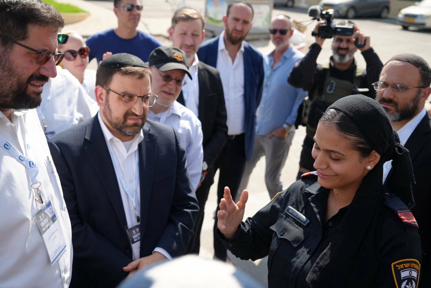 L-R: OU Israel Executive Director Rabbi Avi Berman, OU National Director of Community Engagement Rabbi Yaakov Glasser and other rabbis and lay leaders, hear from Israeli police officer Hodaya Harrush, who had returned for the first time to the Sderot police station where her late husband was one was one of the first police officers to fall in the heroic defense of Sderot.